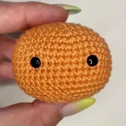 Amigurumi pumpkin witch head